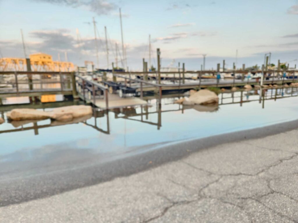 a body of water with a dock and boats in it (MyCoast AI)