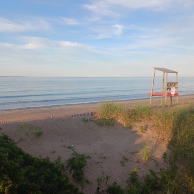 a sandy beach with a structure in the middle (MyCoast AI)