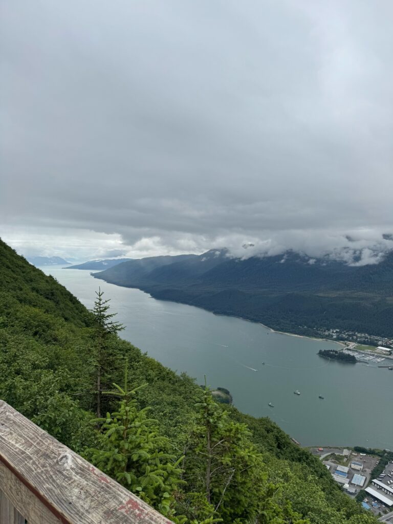 a body of water with a city by it and mountains in the back (MyCoast AI)