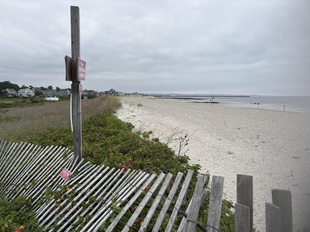 a wooden fence on a beach (MyCoast AI)