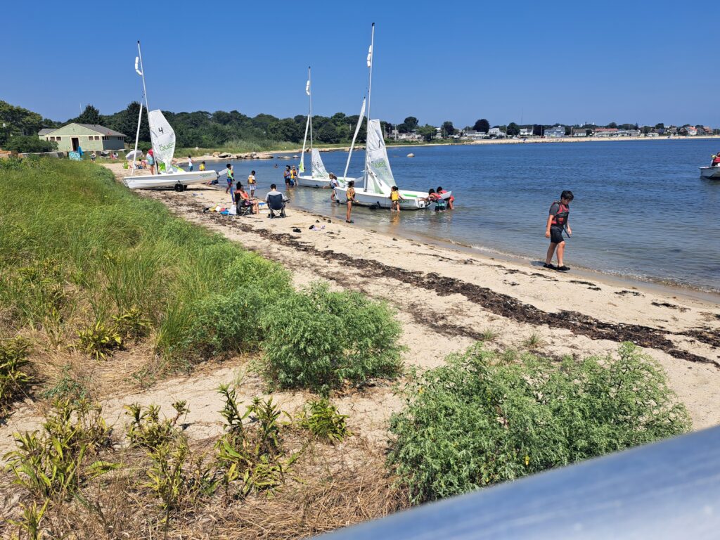 a group of people on a beach (MyCoast AI)