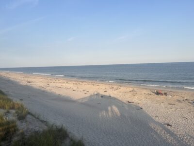 a sandy beach with water and blue sky (MyCoast AI)
