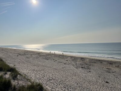 a beach with people on it (MyCoast AI)