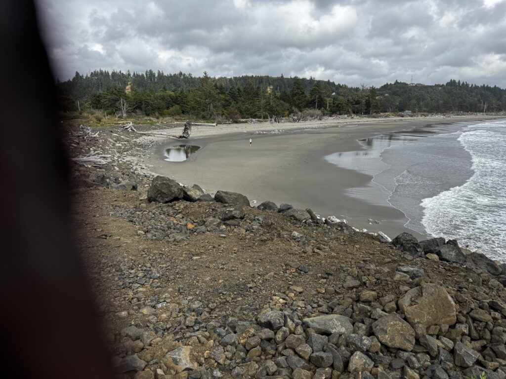 a rocky beach with a boat (MyCoast AI)