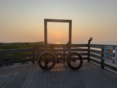 a bicycle parked on a wooden deck (MyCoast AI)