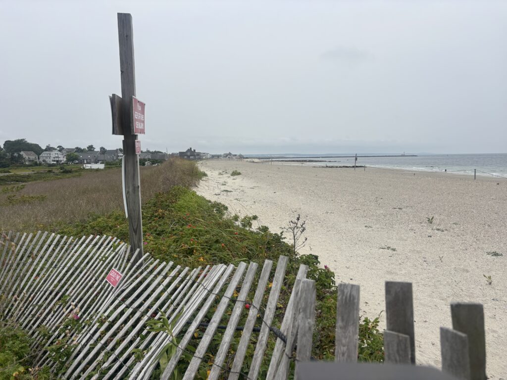 a wooden fence on a beach (MyCoast AI)