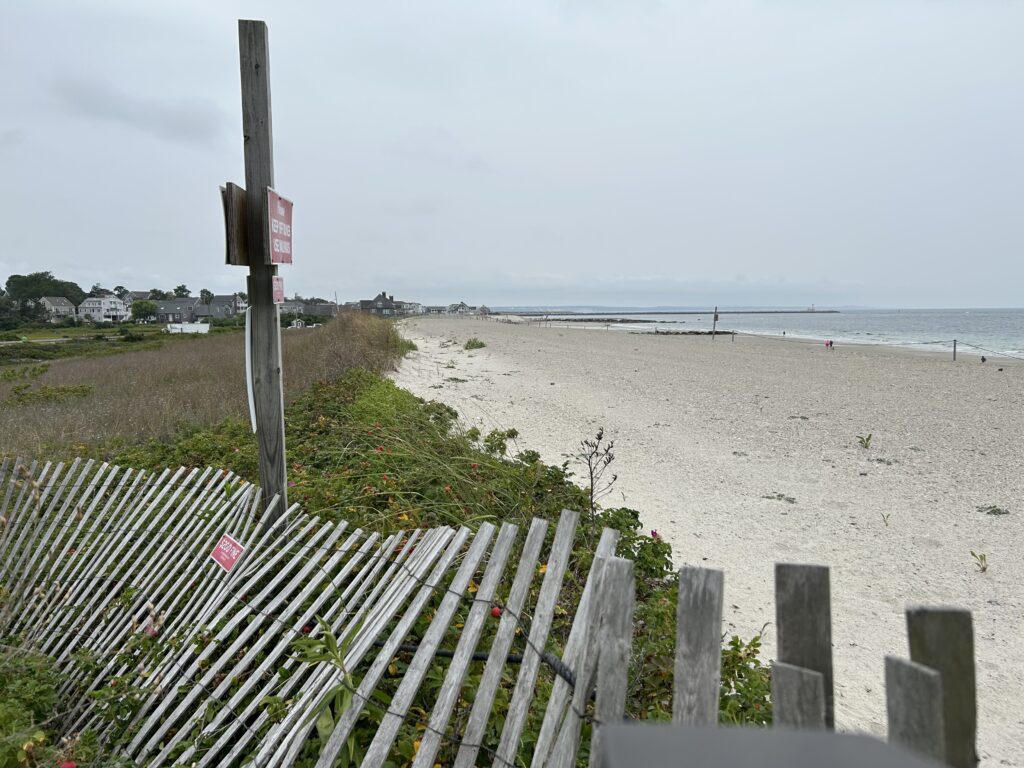 a wooden fence on a beach (MyCoast AI)
