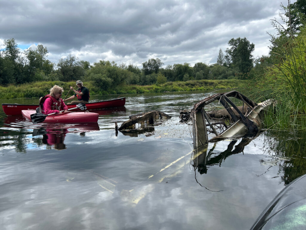 a group of people in canoes on a river (MyCoast AI)