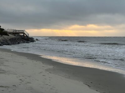 a beach with waves crashing on it (MyCoast AI)