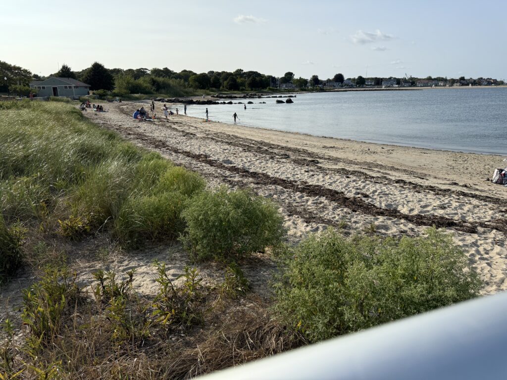 a beach with people and boats (MyCoast AI)