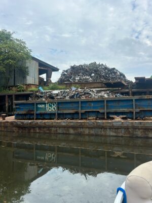 a large pile of garbage on a dock (MyCoast AI)