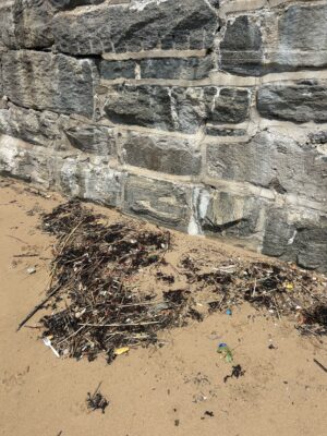 a rock wall with a hole in it (MyCoast AI)