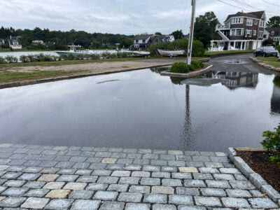 a flooded street with houses (MyCoast AI)