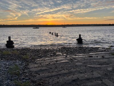 a beach with boats in the water (MyCoast AI)