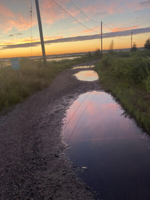 a muddy road with a sunset (MyCoast AI)