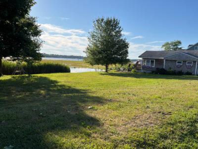 a house with a pond in the front (MyCoast AI)