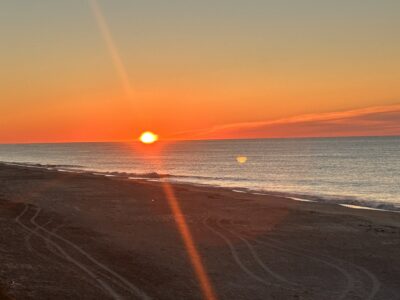 a beach with a sunset (MyCoast AI)