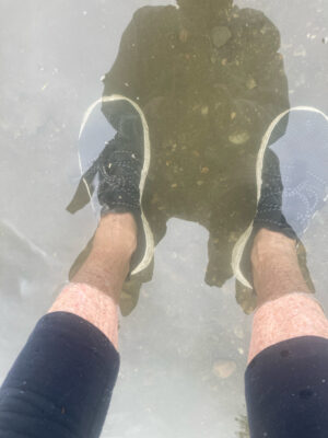 a person holding a large rock (MyCoast AI)