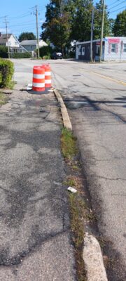 a road with a traffic cone (MyCoast AI)