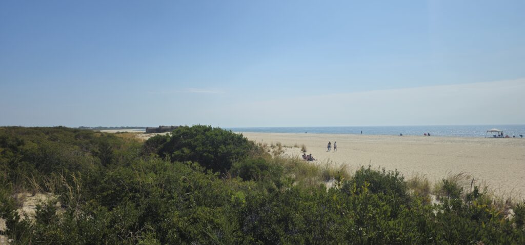 a group of people walking on a beach (MyCoast AI)