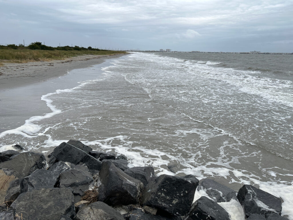 a rocky beach with waves crashing (MyCoast AI)