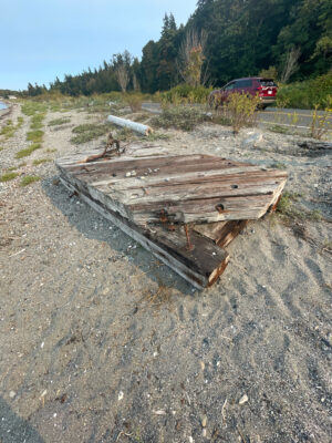 a wooden boat on a road (MyCoast AI)