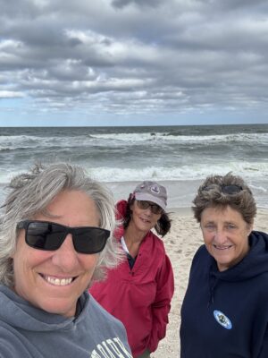 a group of people on a beach (MyCoast AI)