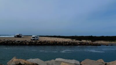 cars parked on a rocky beach (MyCoast AI)