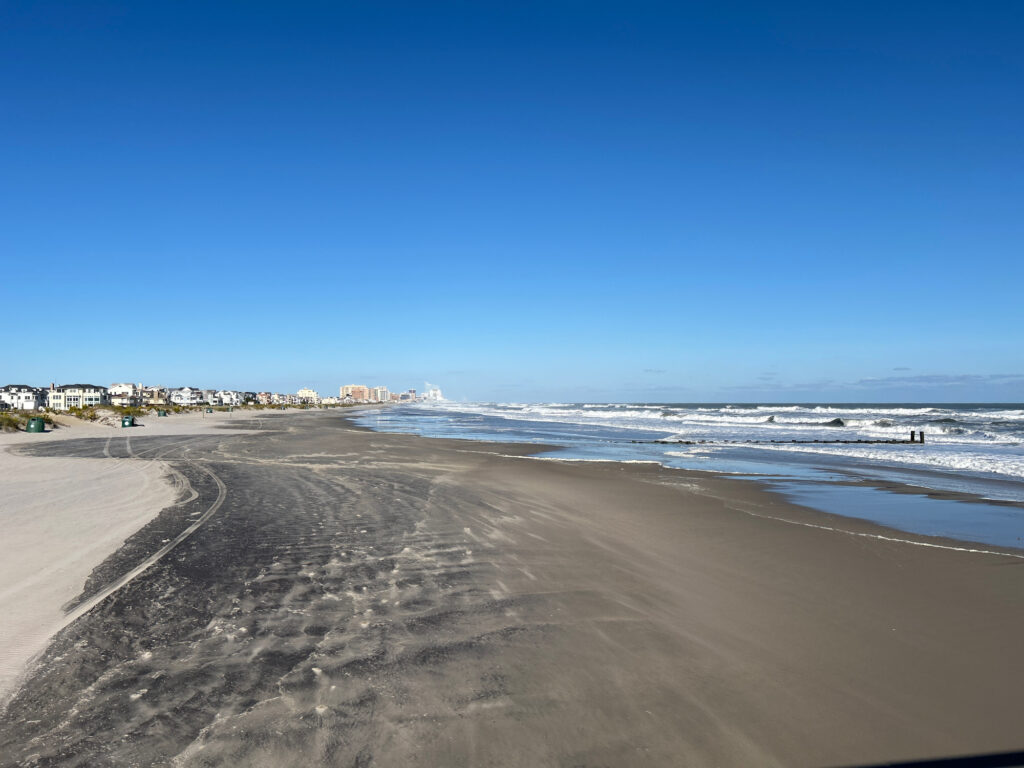 a beach with waves crashing on it (MyCoast AI)