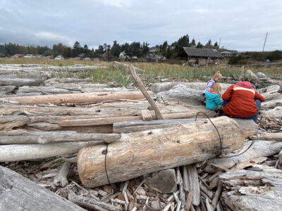 a group of people working on a wood structure (MyCoast AI)
