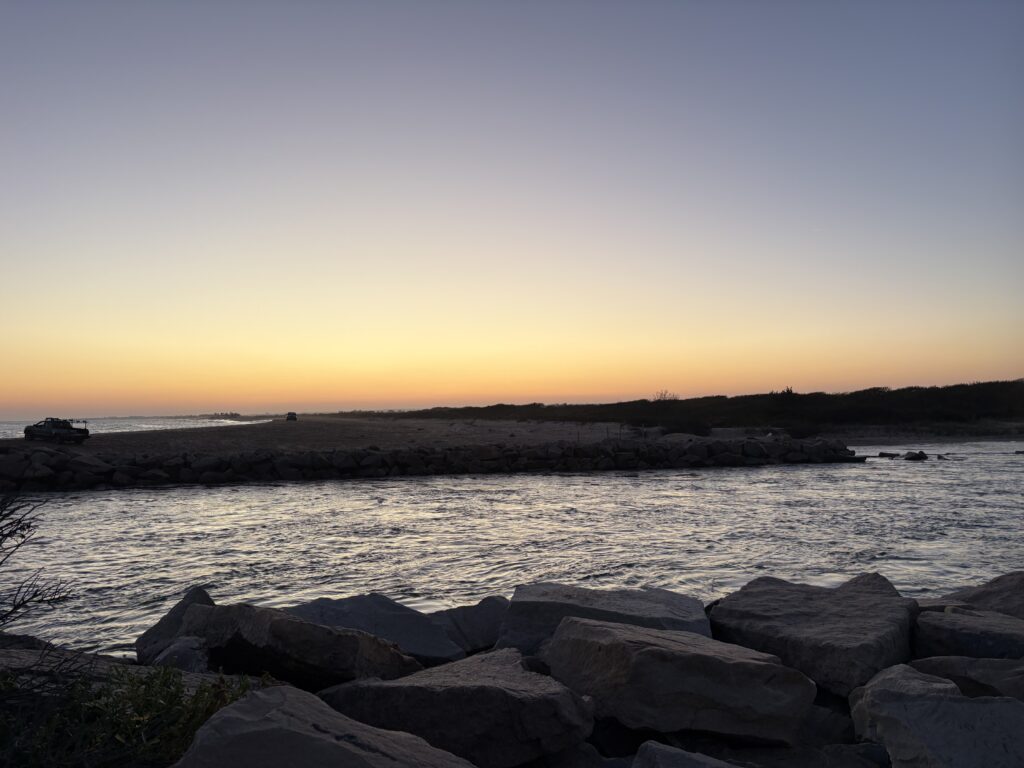 a rocky beach with a sunset (MyCoast AI)