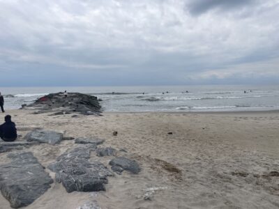 a rocky beach with people on it (MyCoast AI)