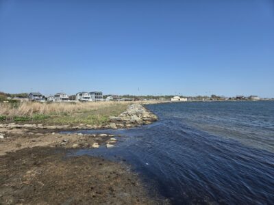 a body of water with houses in the background (MyCoast AI)