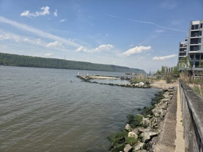 a body of water with rocks and a dock by it (MyCoast AI)